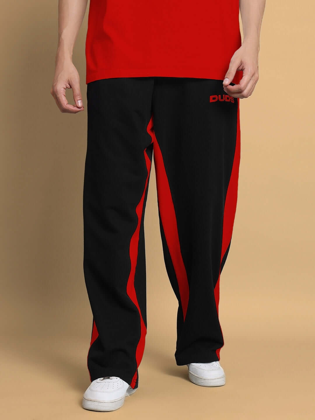 Black and red side seam baggy joggers by DUDS, featuring a casual fit and customizable size option for perfect fit.