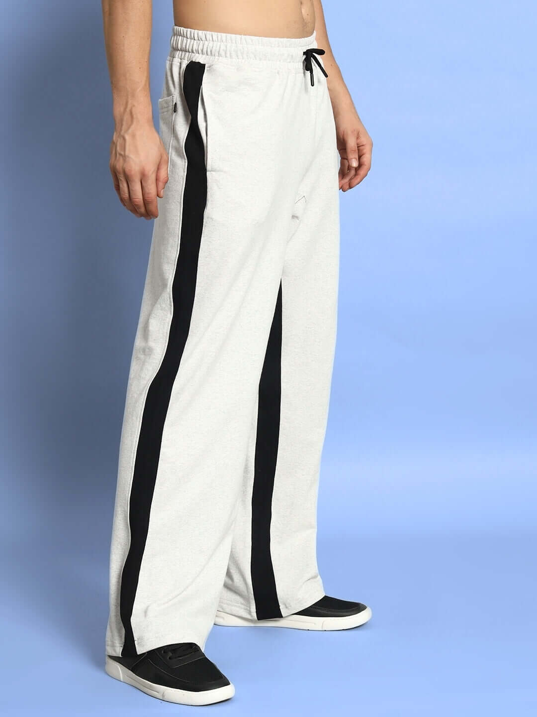 Side seam baggy joggers in melange grey-black, made to order by DUDS, showcasing customizable fit with black stripe detail.