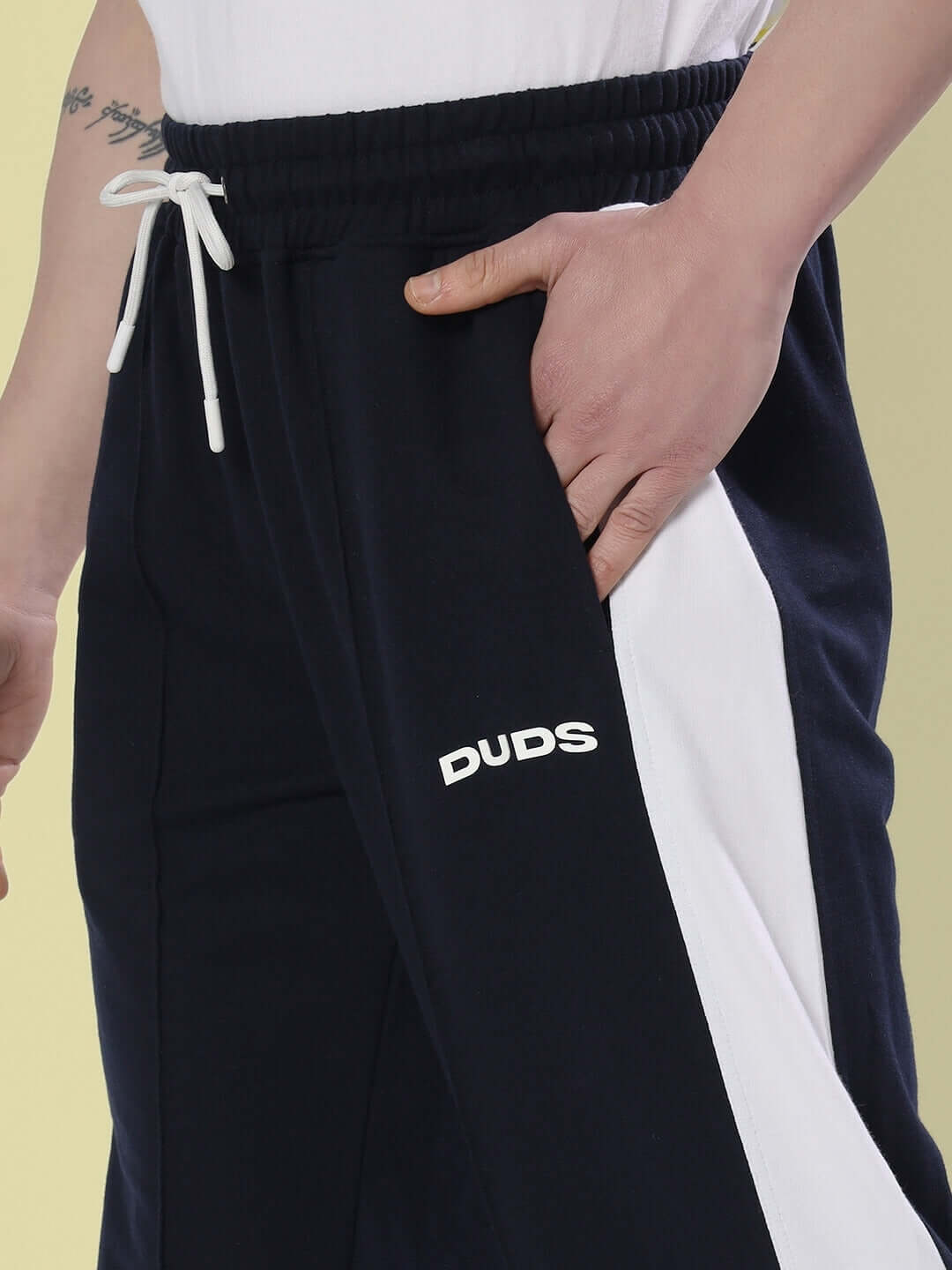 Navy blue side seam plated joggers with white accents, made to order by DUDS experienced tailors, featuring customization options.
