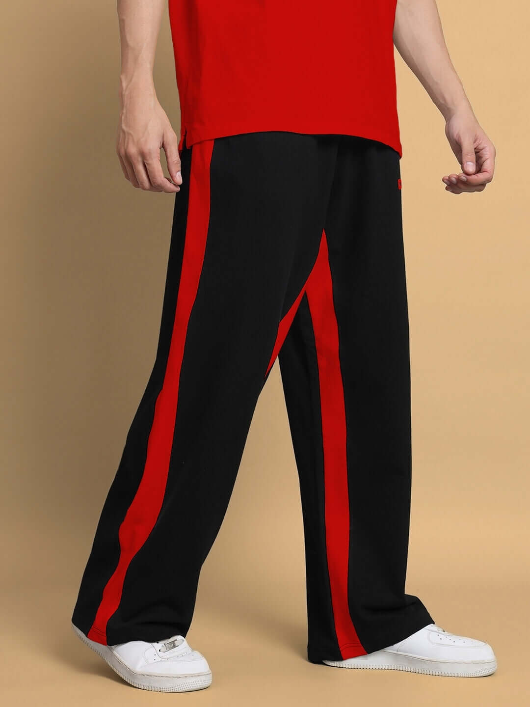 Men's black and red side seam baggy joggers by DUDS, made to order for custom fit, with red stripes and casual style.