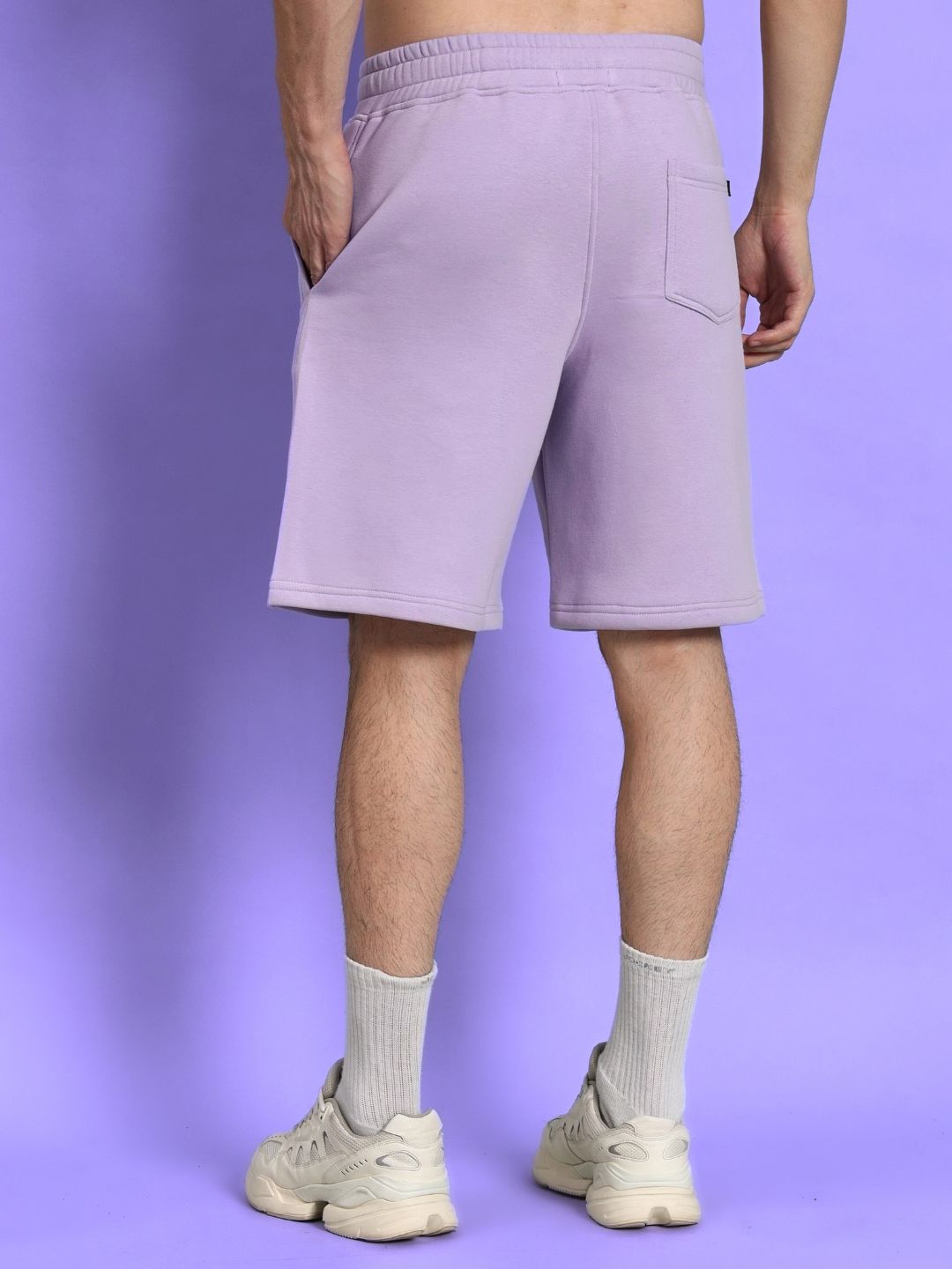 Rear view of SILENT HUG PRINTED FLEECE CO-ORD LILAC shorts in lilac tone, modeled against a matching background.