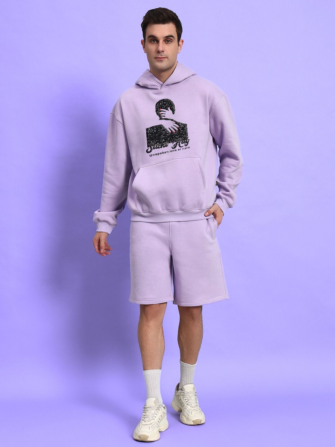 Model wearing SILENT HUG PRINTED FLEECE HOODIE LILAC, showcasing the cozy and stylish lilac fleece hoodie with printed details.