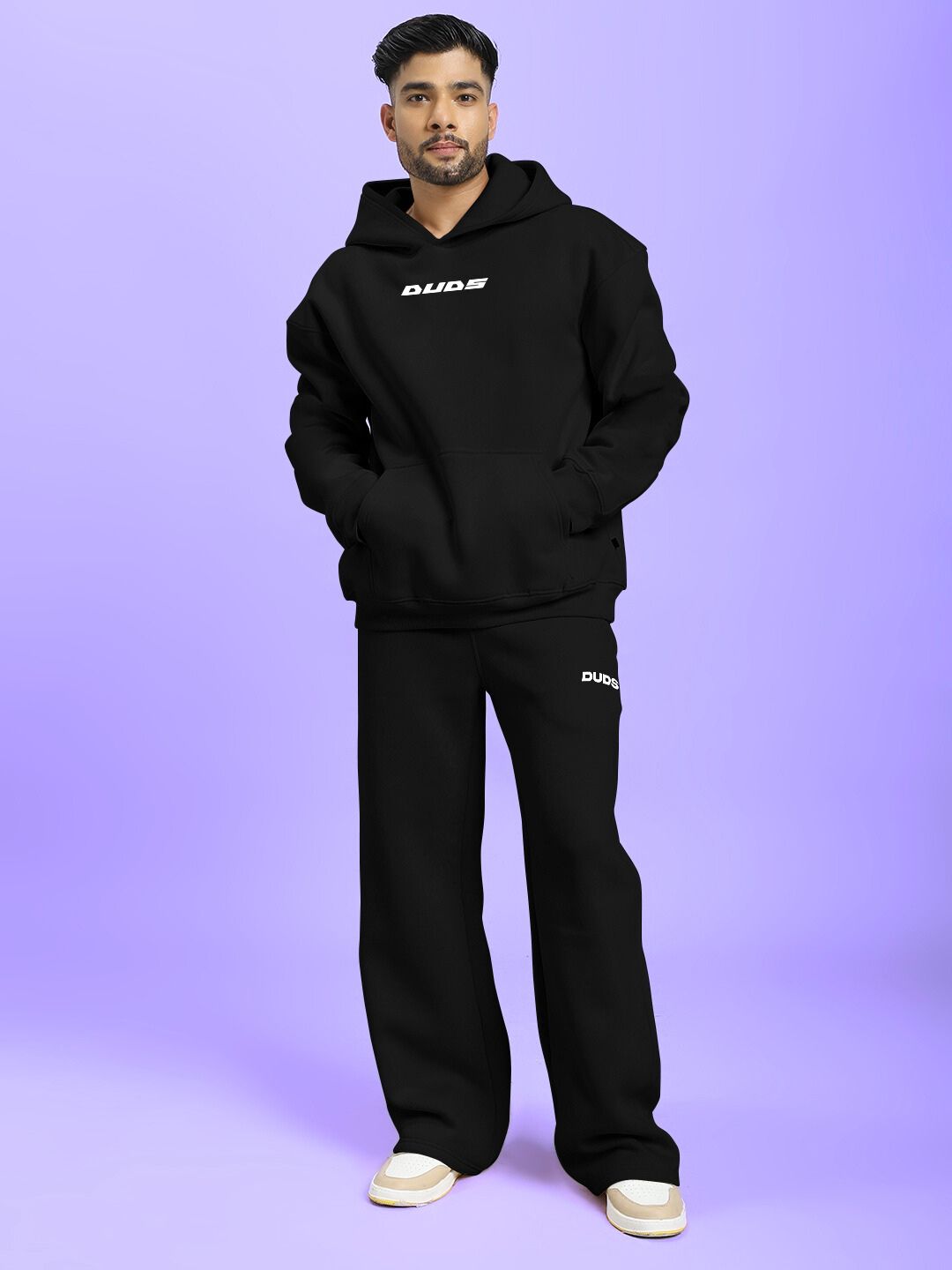 Model wearing SILVER SURFER FLEECE CO-ORD SET BLACK on a purple background, showcasing the stylish design of the fleece outfit.