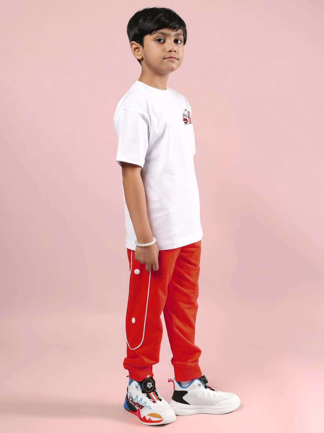 SIMPSONS CO-ORD FOR BOYS & GIRLS WHITE-RED, stylish outfit made by DUDS, featuring white T-shirt and red pants for kids.