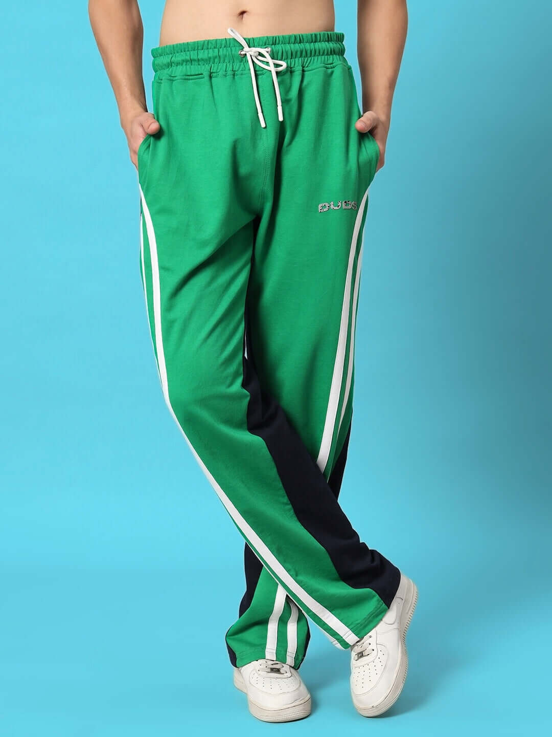Person wearing Skater Korean Baggy Joggers in Green Black, featuring drawstring waist and stripe design, ideal for casual wear.