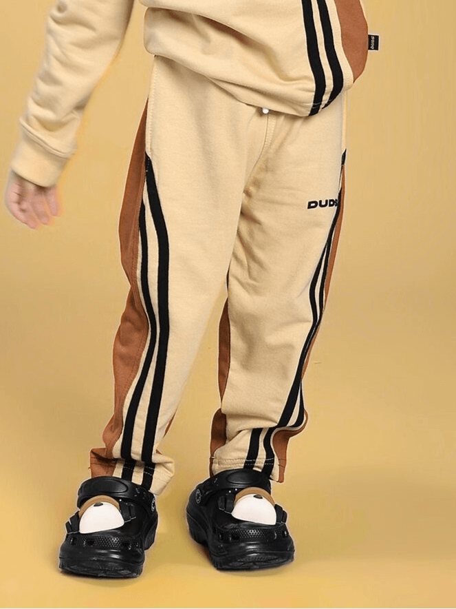 SKATER KOREAN JOGGER FOR BOYS AND GIRLS CREAM BROWN, trendy kids joggers with stripes, versatile streetwear fashion.