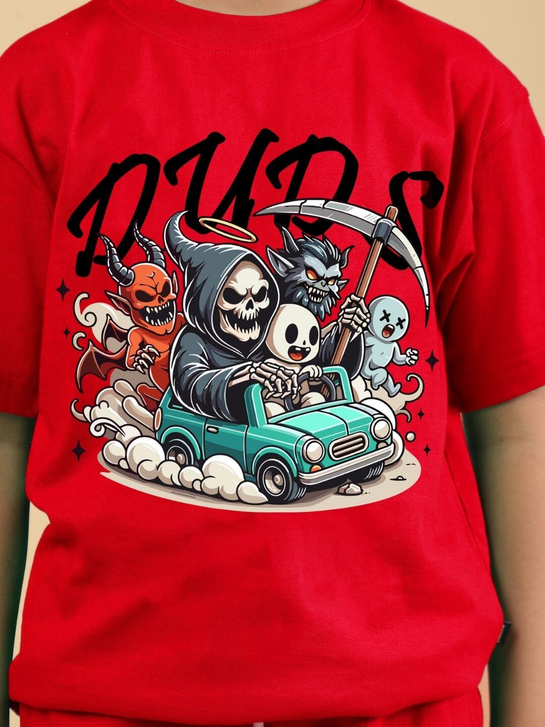 Child wearing SKELETON RIDER CAR PRINT CO-ORD FOR BOYS AND GIRLS RED with skeleton driving a car design.