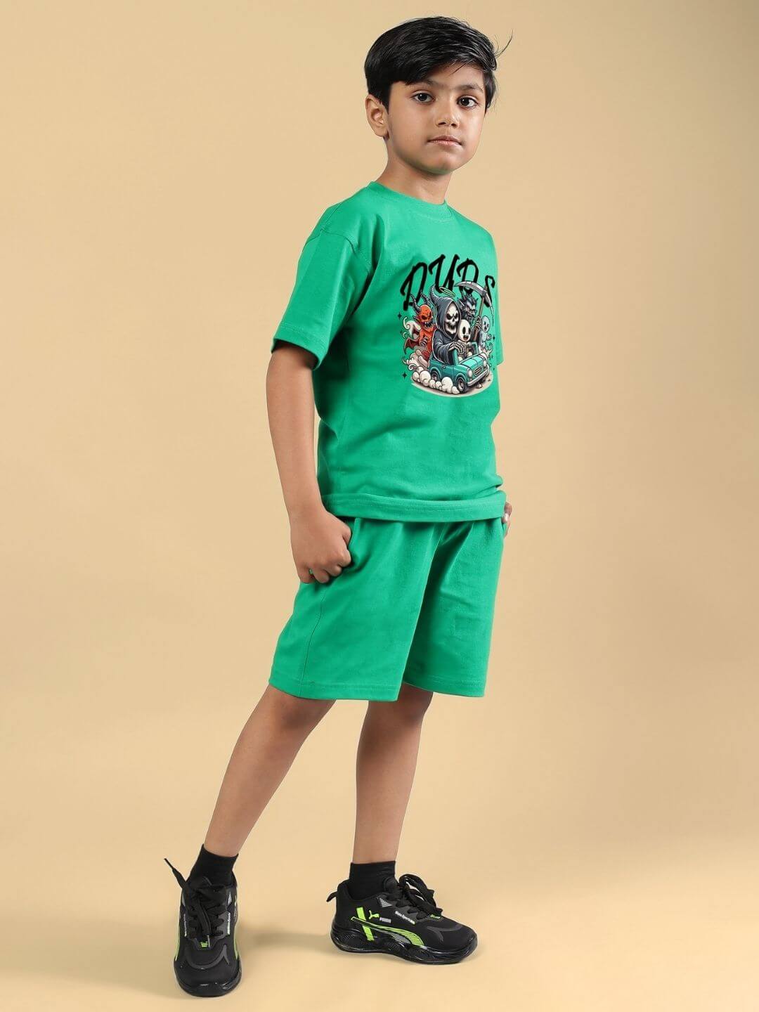 Boy wearing Skeleton Rider Car Print Co-ord for Boys and Girls Green, stylish and adventurous kids outfit.