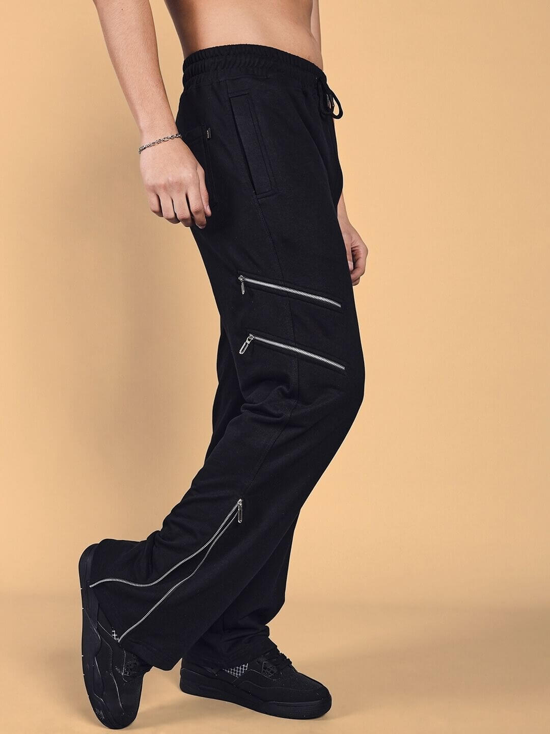 Black Skidder Cargo Pant with zipper pockets, customizable fit by DUDS, side view on model, tailored by experienced tailors, made-to-order.