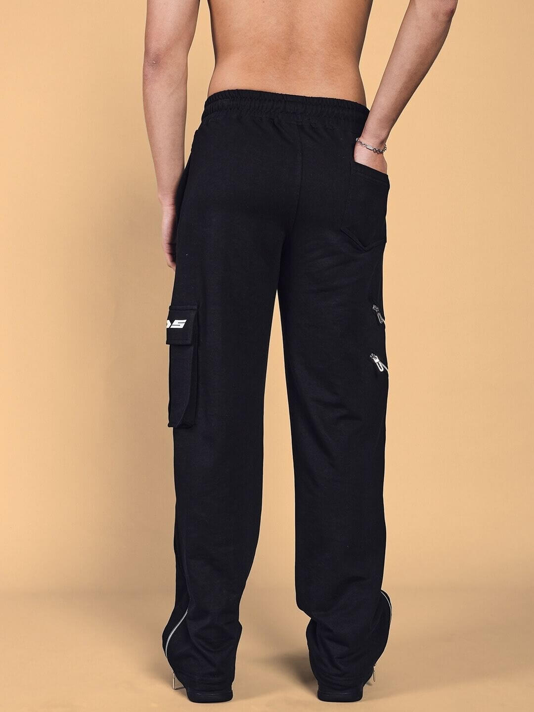 Back view of SKIDDER Cargo Pant in black, featuring a tailored fit with cargo pocket detailing. An ideal choice for custom sizing options.