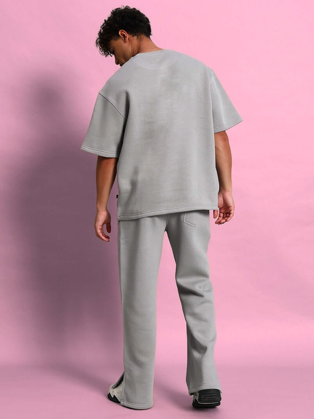 Model wearing SKODA COTTON FLEECE CO-ORD GREY set with relaxed-fit top and joggers, perfect for comfort and style in casual settings.