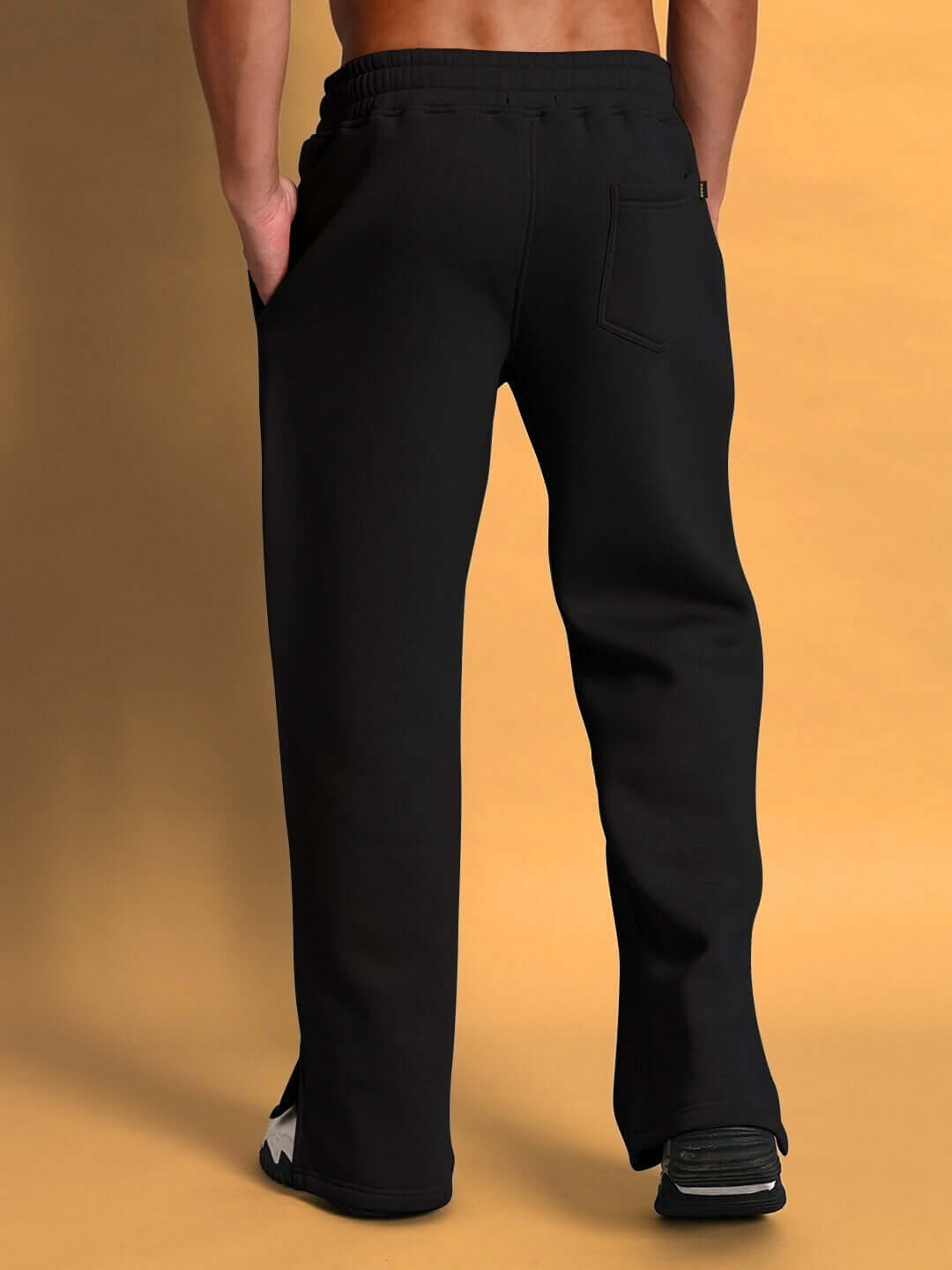 Back view of SKODA black cotton fleece jogger pants, showcasing comfortable fit and tailored craftsmanship.
