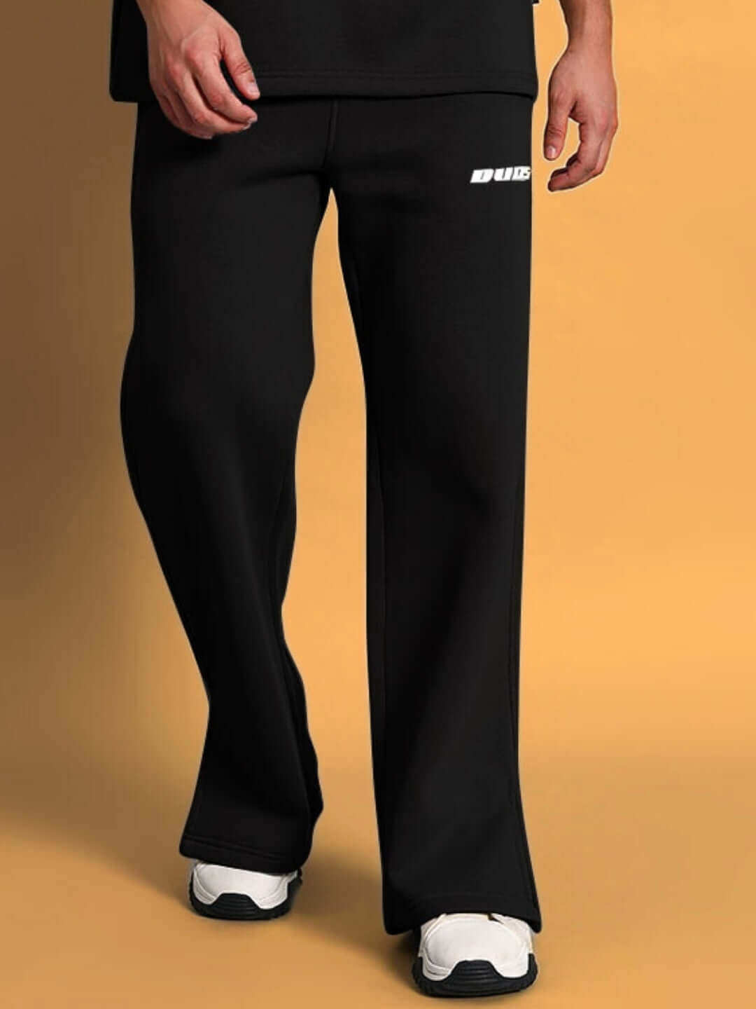 Black SKODA cotton fleece jogger pants displayed on a model, showcasing the comfortable fit and stylish design by DUDS.