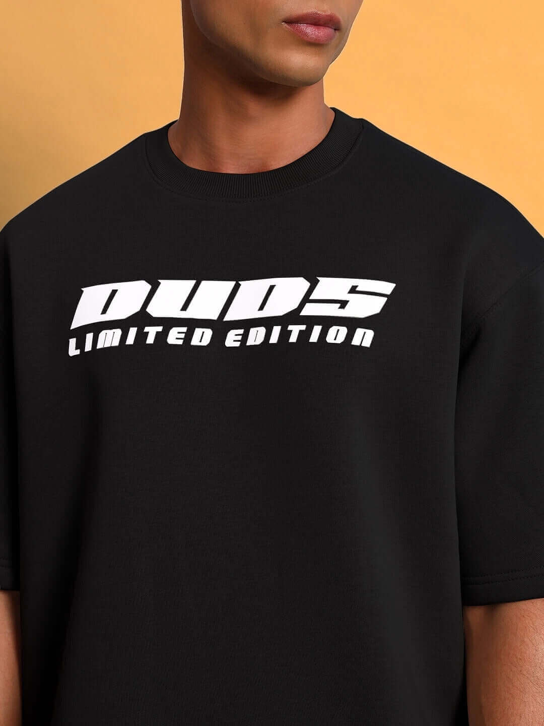 Close-up of WEARDUDS SKODA FLEECE CO-ORD BLACK featuring DUDS Limited Edition print on the front.