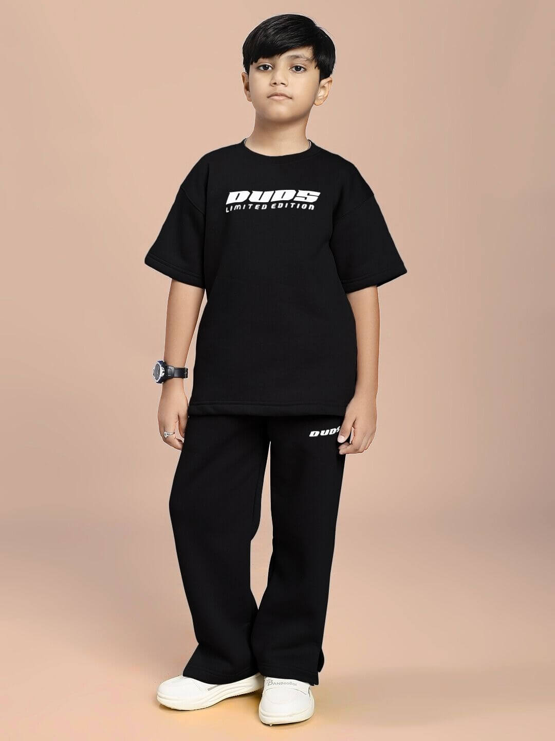 Child wearing SKODA FLEECE CO-ORD FOR BOYS AND GIRLS BLACK, stylish and comfortable, ideal for trendy kids, modern black color matching set.
