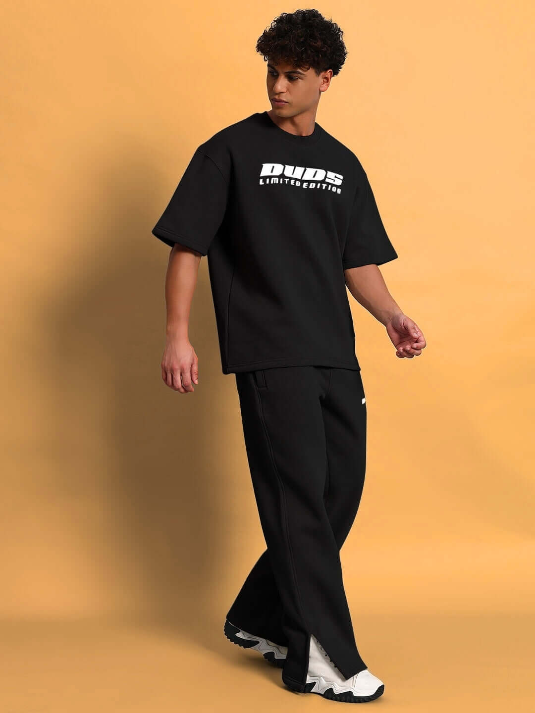 Model wearing WEARDUDS SKODA FLEECE CO-ORD BLACK, showcasing custom fit fashion.