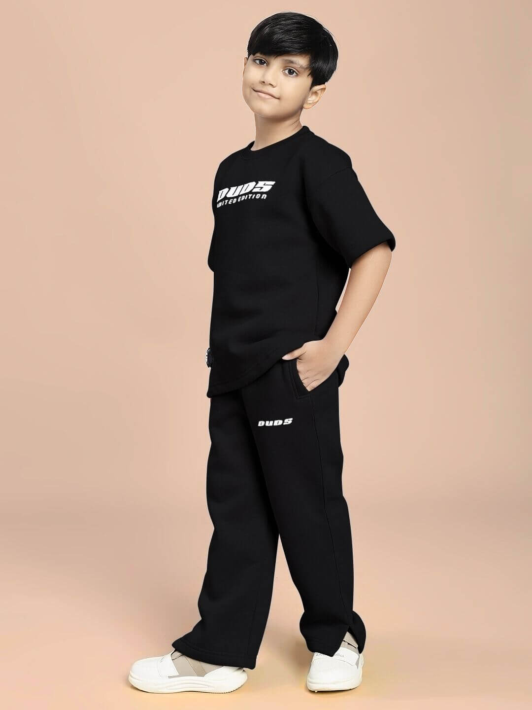 SKODA FLEECE CO-ORD FOR BOYS AND GIRLS BLACK offering comfort and style, worn by child with sneakers in modern fashion
