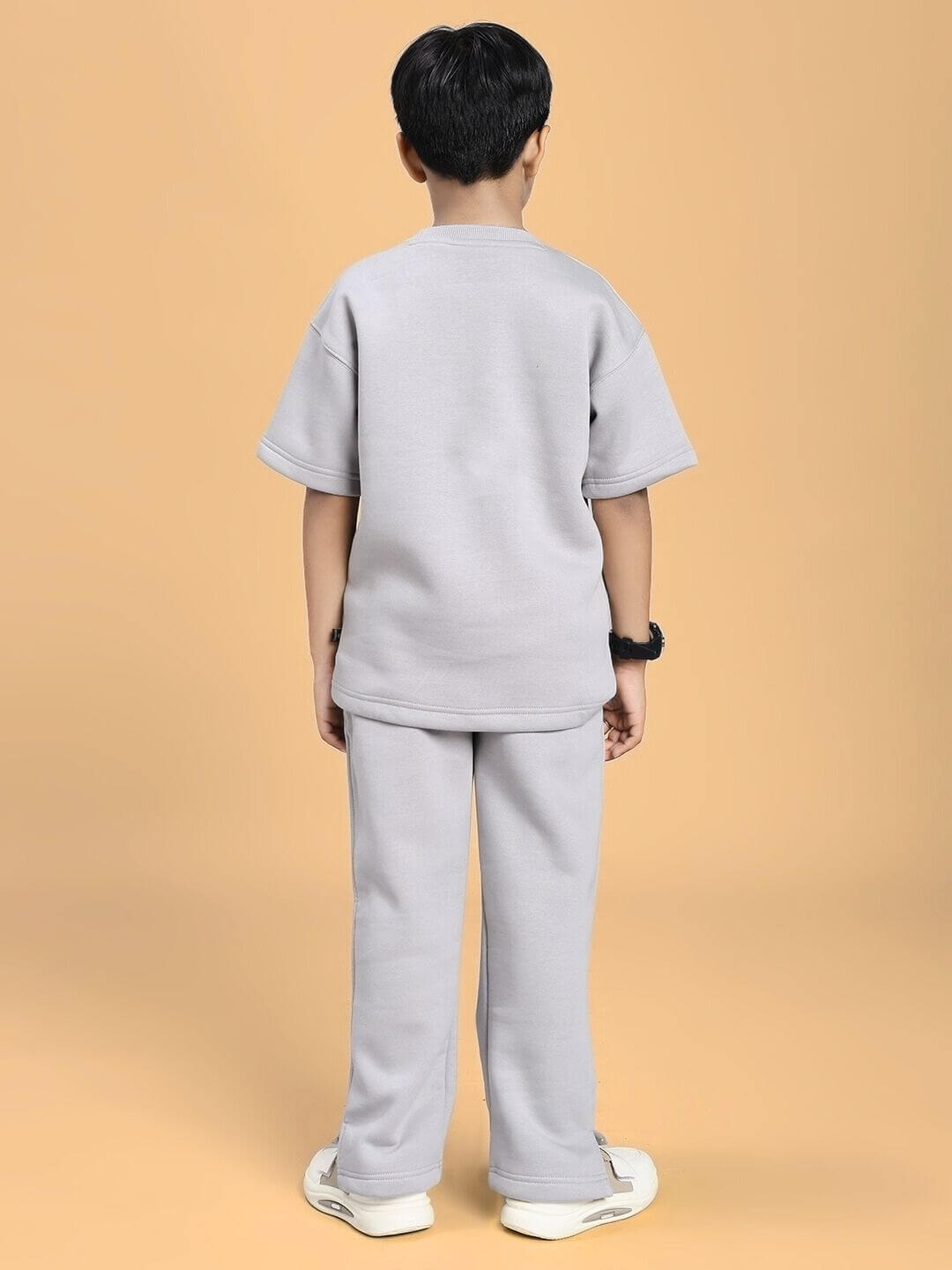 Rear view of child wearing SKODA FLEECE CO-ORD FOR BOYS AND GIRLS GREY, showcasing comfort and style in a cozy fleece outfit.