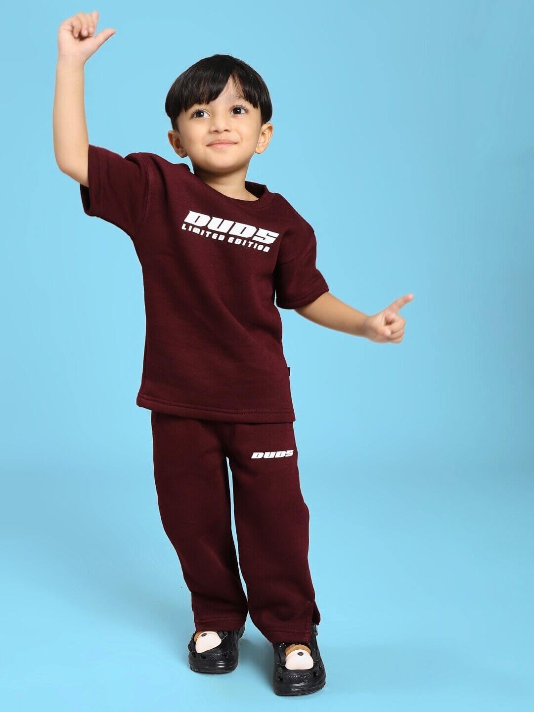 Child wearing SKODA FLEECE CO-ORD FOR BOYS AND GIRLS MAROON, showcasing cozy two-piece set ideal for fall and chilly days.