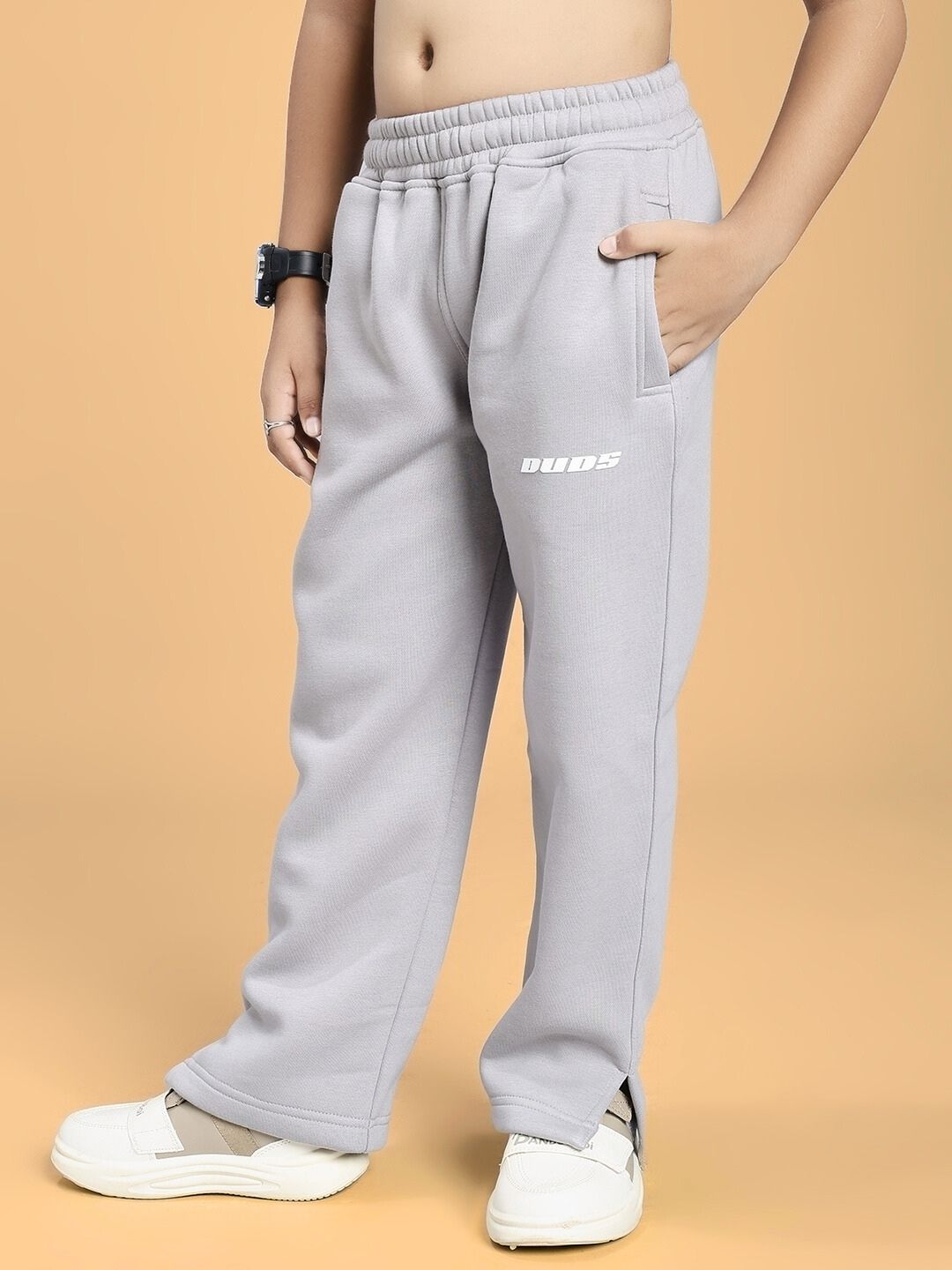 Child wearing SKODA FLEECE JOGGER FOR BOYS AND GIRLS GREY, ultra-soft brushed fleece with relaxed fit and subtle side stripe.