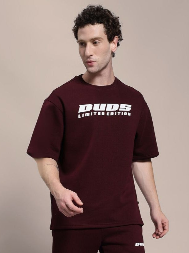Man wearing SKODA FLEECE OVERSIZED T-SHIRT MAROON for casual style