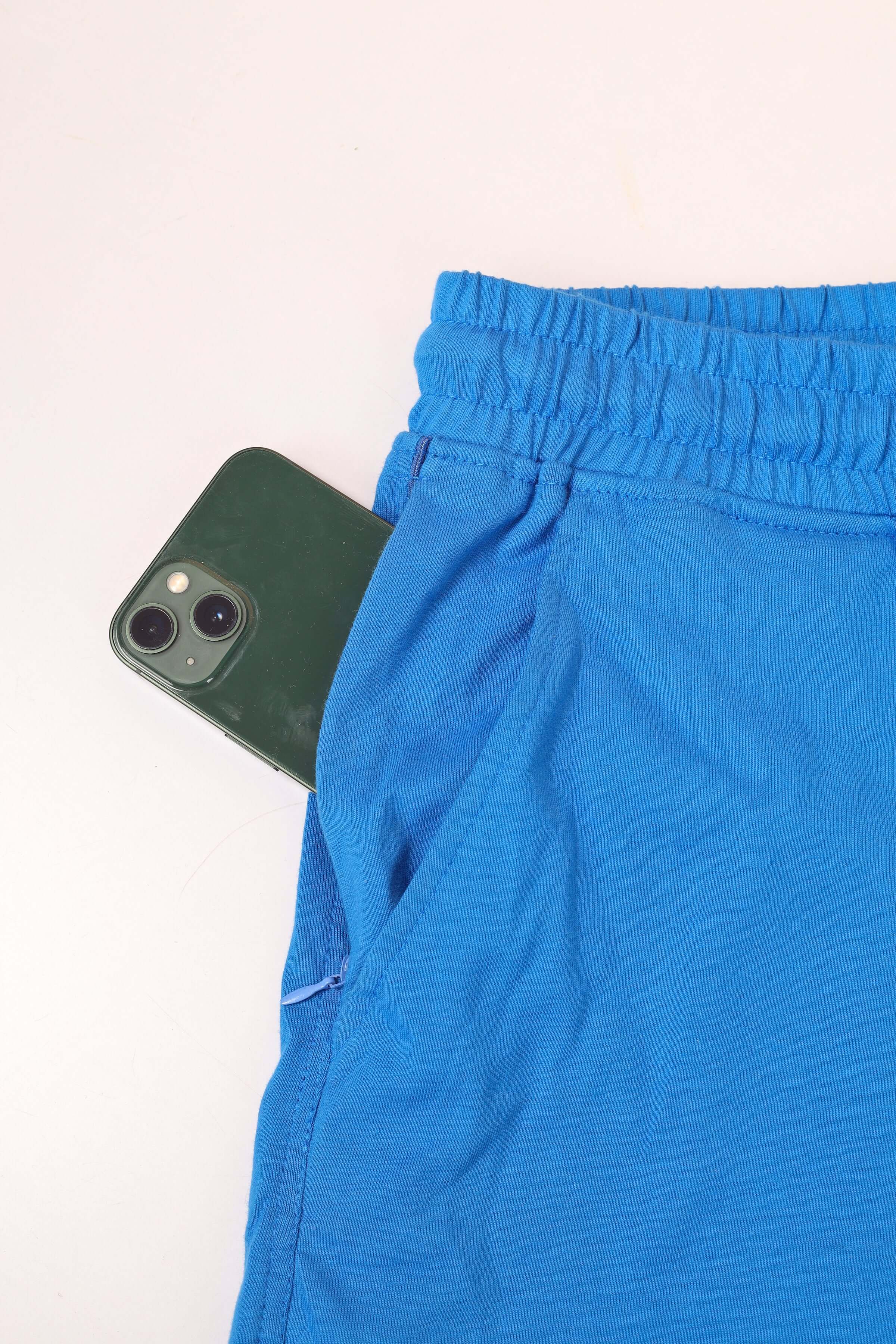 Blue regular fit shorts with skull butterfly design, featuring deep pockets. Custom fit available for prepaid orders. Stylish and comfortable.