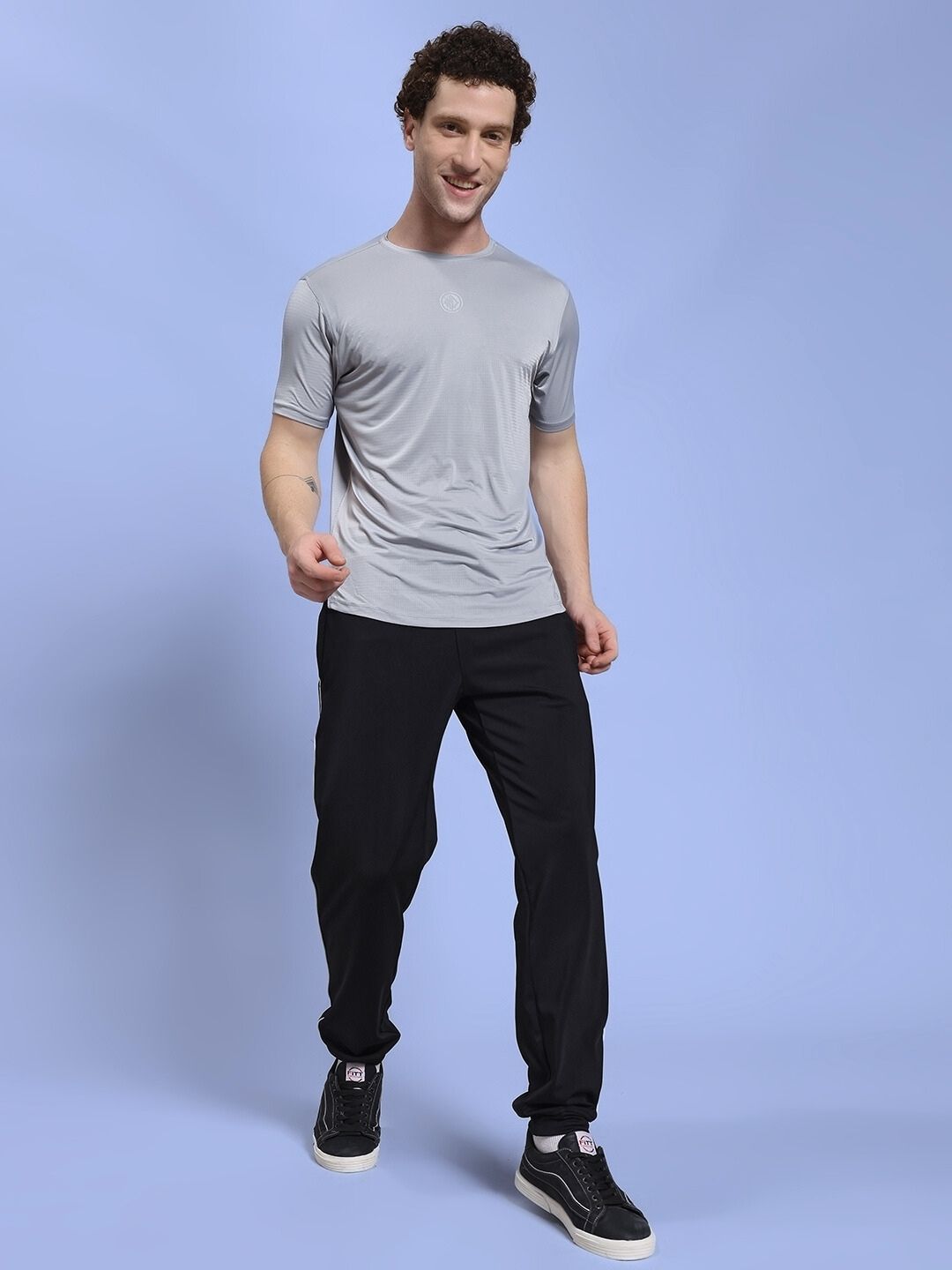 Person wearing SKY BOLT RELAXED FIT JOGGER BLACK for a casual streetwear look