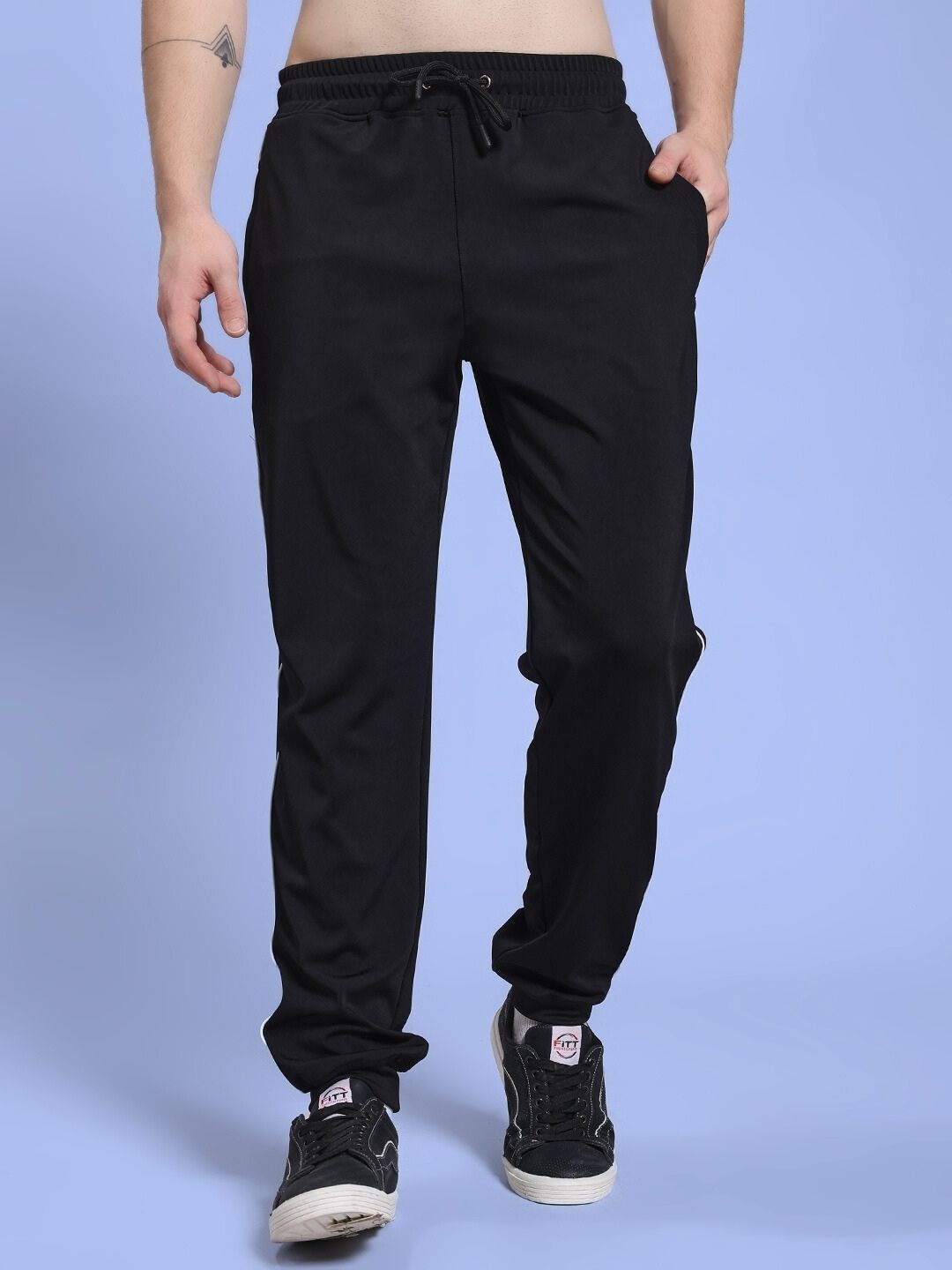 Man wearing SKY BOLT RELAXED FIT JOGGER BLACK, showing casual streetwear style.