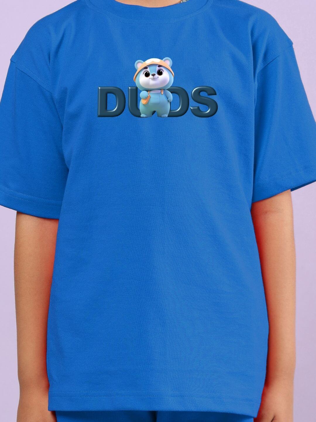 Child wearing SMILEY BEAR CO-ORD FOR BOYS AND GIRLS BLUE with cute bear graphic on blue shirt for playful everyday adventures.