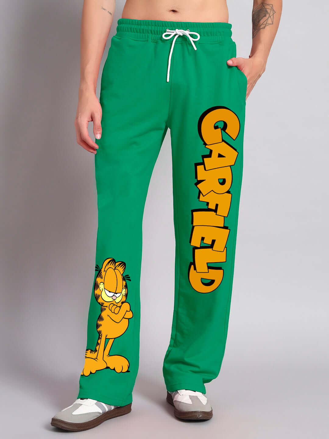 Person wearing SMUG GARFIELD relaxed fit jogger, green, with Garfield print, customizable size option available from DUDS.