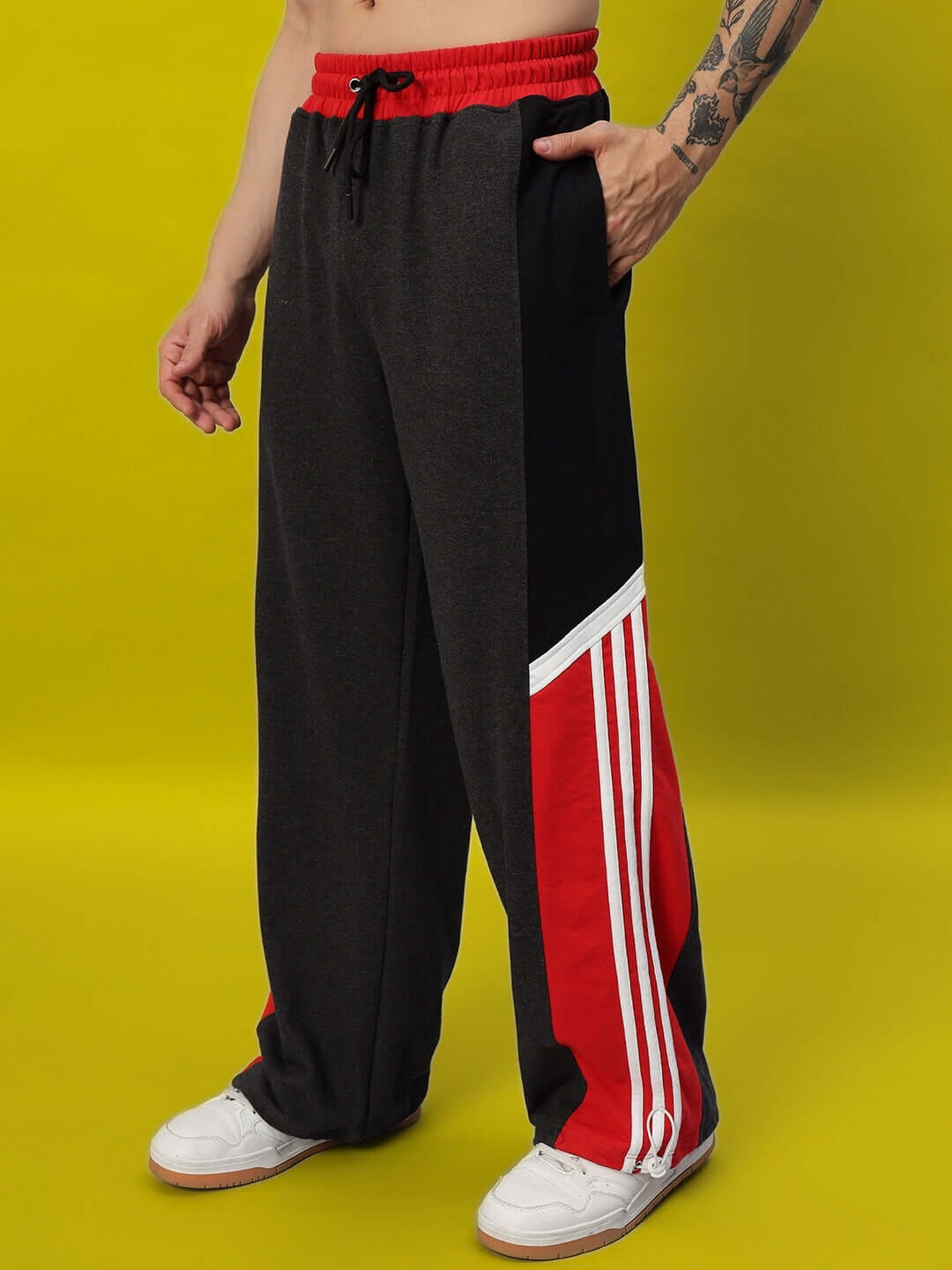 Stylish Snicker Relaxed-Fit Joggers in Dark Grey and Red, designed by DUDS, featuring drawstring waist and custom fit options.