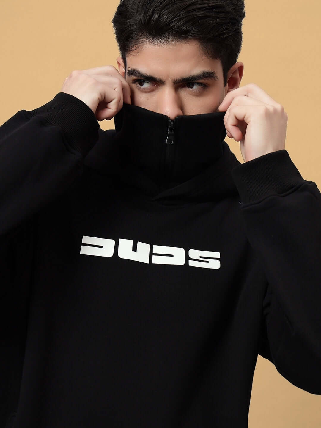 Model wearing SNIPPER COTTON FLEECE HOODIE BLACK, displaying modern streetwear design with full zip collar.
