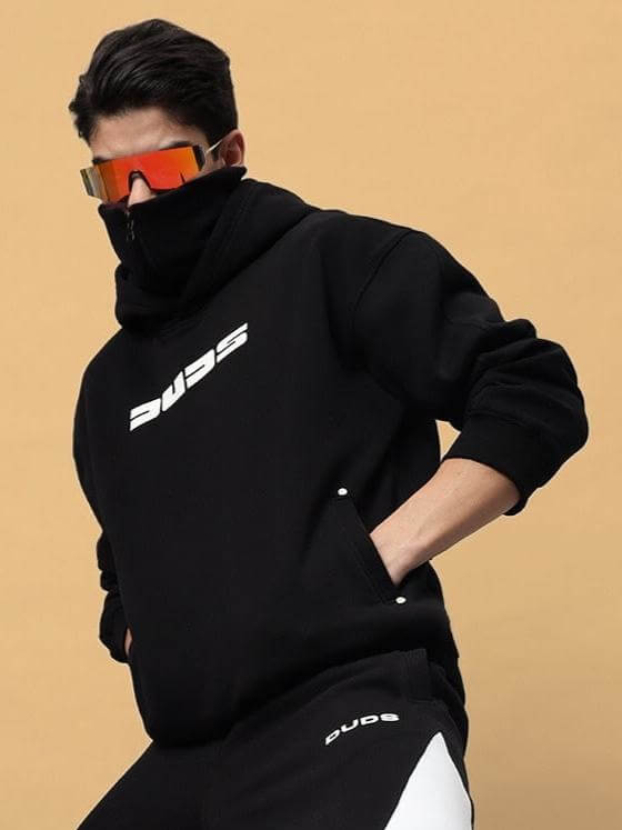 Model wearing SNIPPER COTTON FLEECE HOODIE BLACK with sunglasses, showcasing streetwear style.