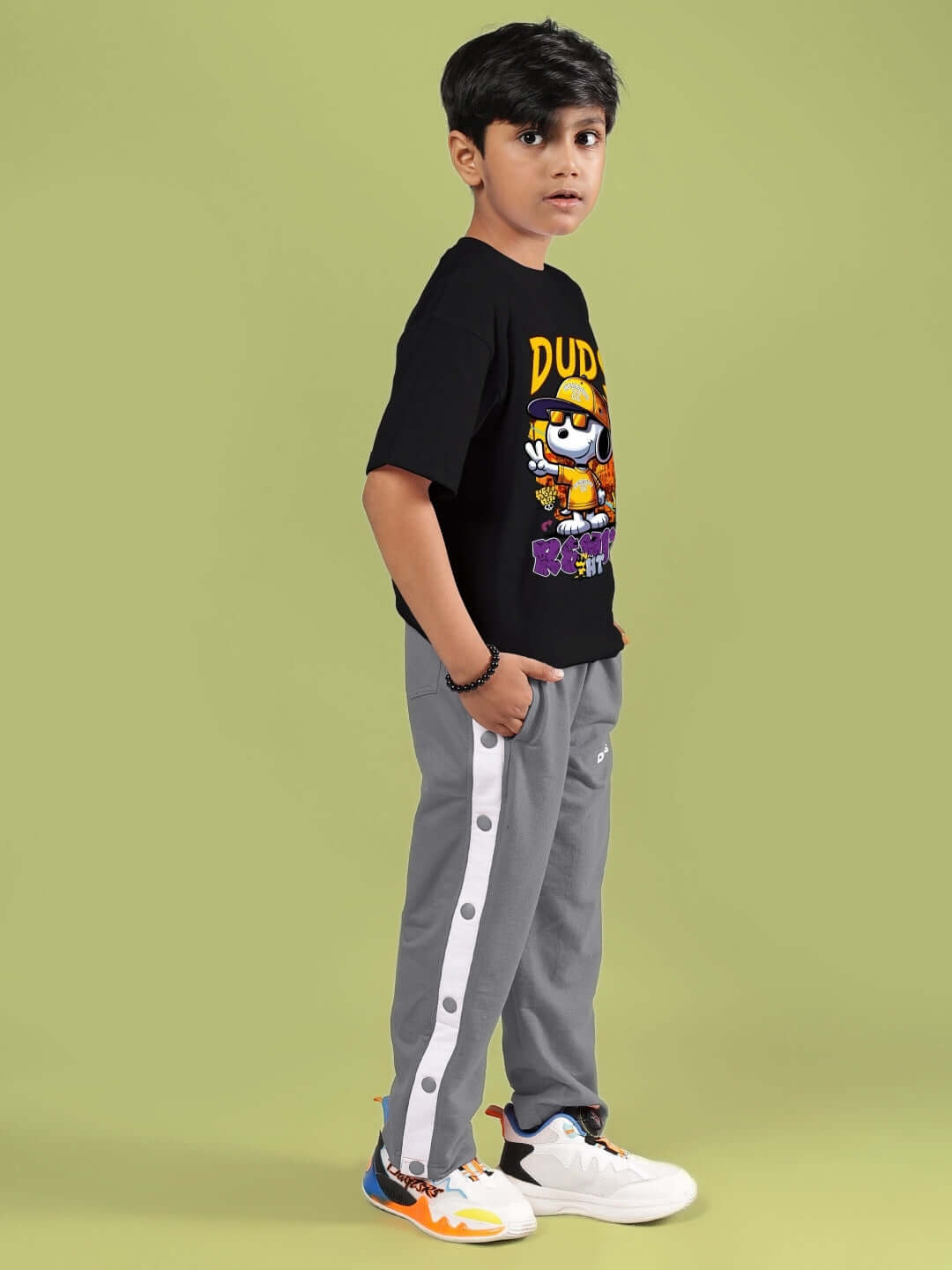 Boy wearing SNOOPY RIMIX CO-ORD FOR BOYS & GIRLS BLACK GREY outfit standing sideways