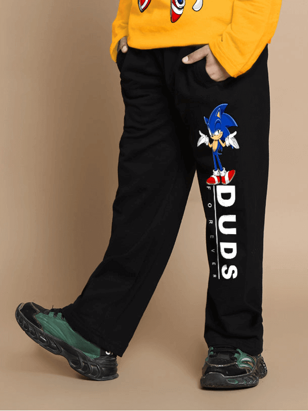 Child wearing yellow-black Sonic-themed DUDS outfit, featuring black pants with Sonic design, suitable for boys and girls.