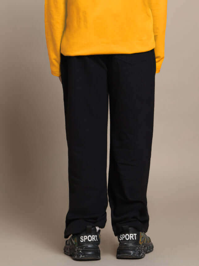 Yellow and black Sonic co-ord for boys and girls, featuring a yellow top with black pants, ideal for kids' activewear from DUDS.