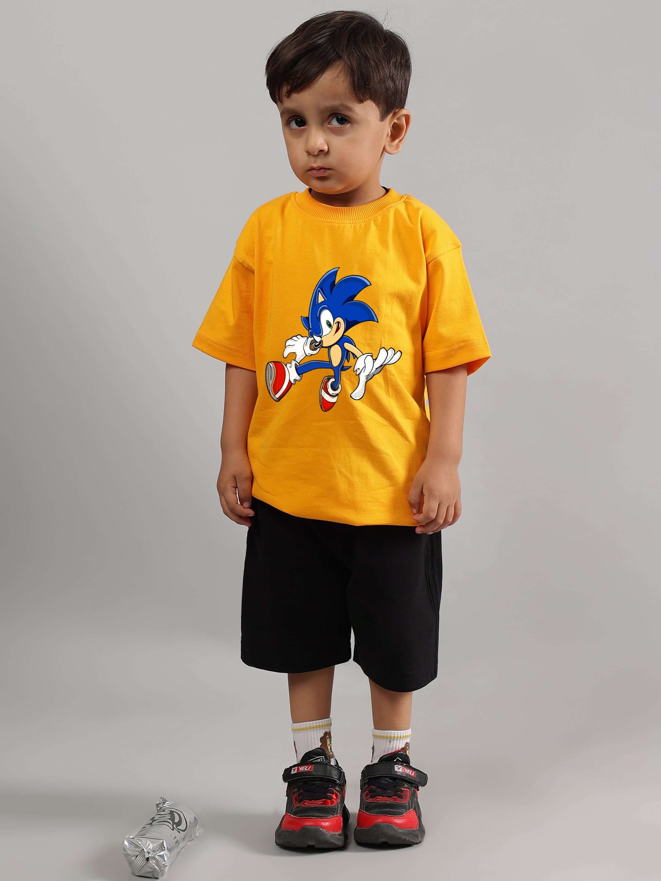 Boy wearing SONIC SUMMER CO-ORD FOR BOYS GIRLS YELLOW-BLACK with Sonic print, showcasing fun and stylish kids' fashion.