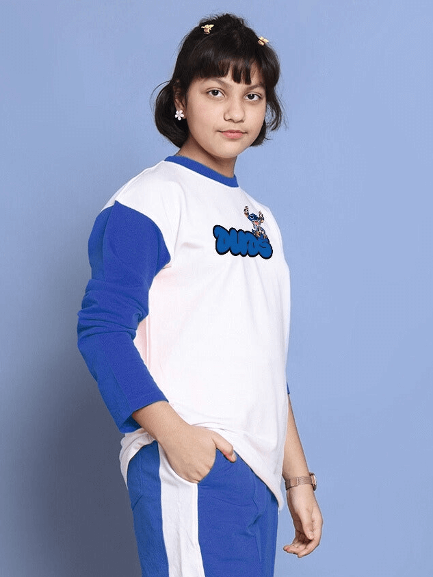 Child wearing white and blue oversized sweatshirt with cartoon graphic, made of 100% cotton, standing against a blue background.