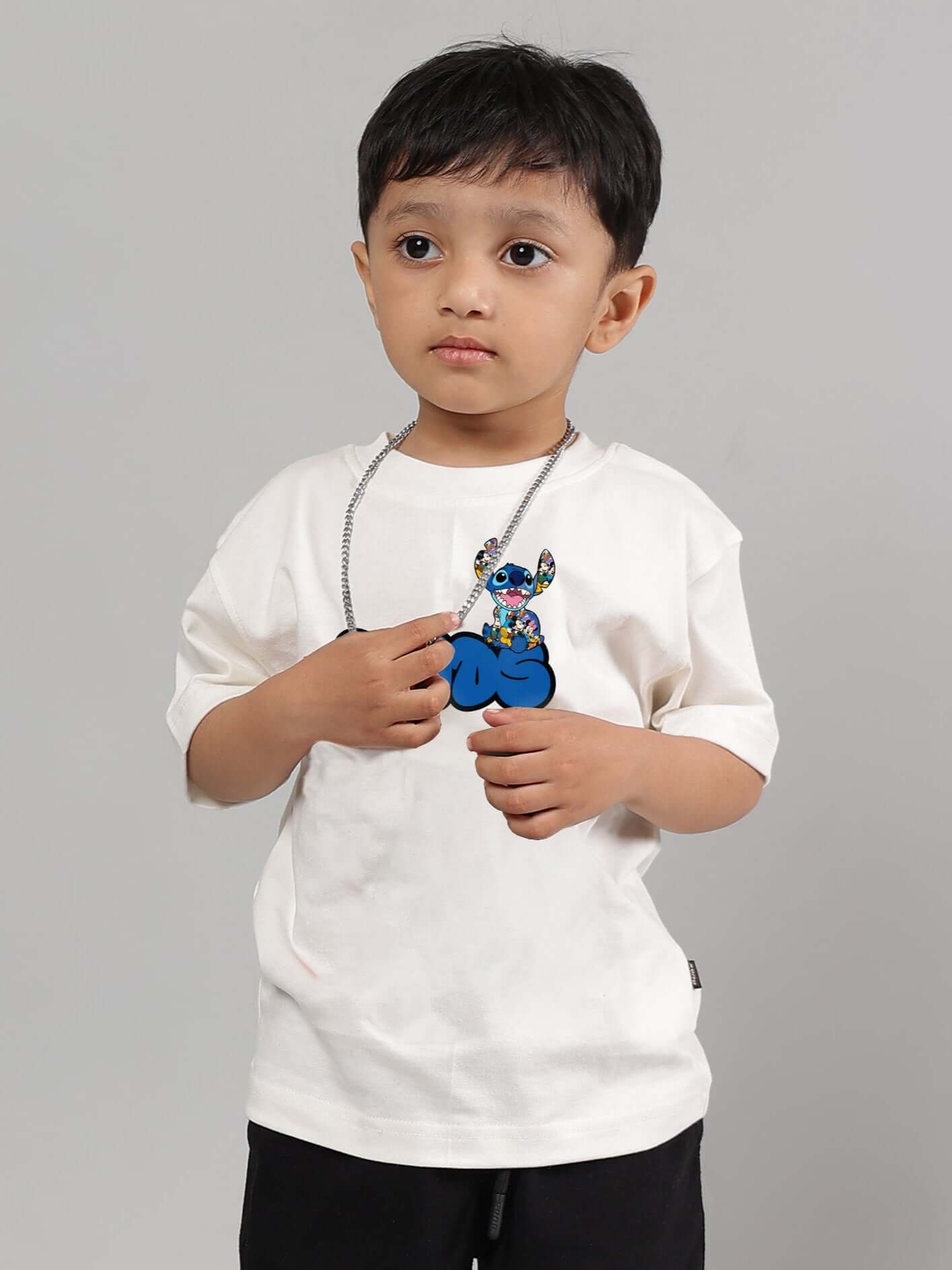 Boy wearing SORE off white t-shirt featuring blue graphic print, suitable for both boys and girls, customizable size, made to order.