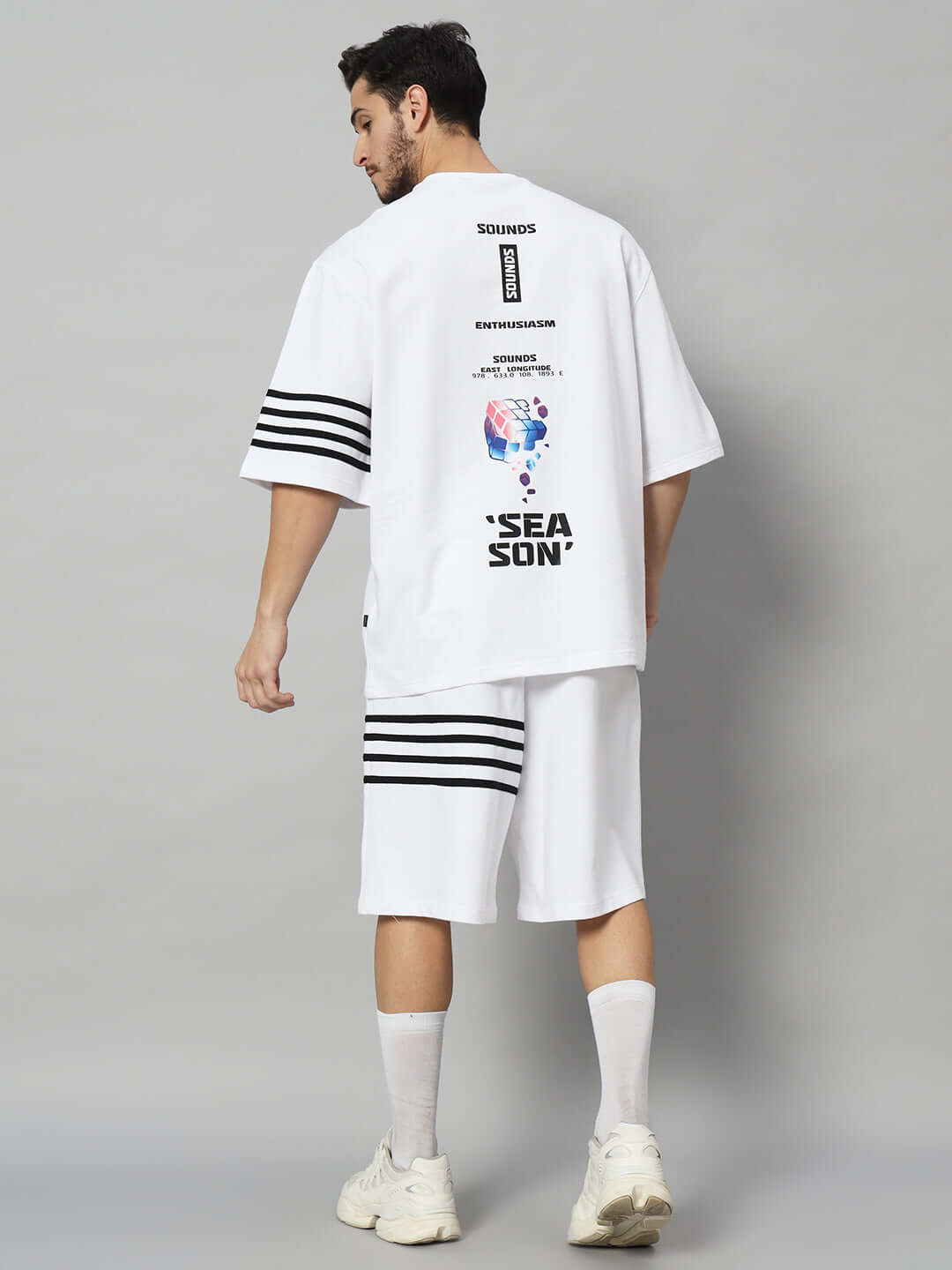 Model wearing SOUND SEASON white co-ord set of premium cotton French terry lycra, featuring bio-wash and bold graphic design.