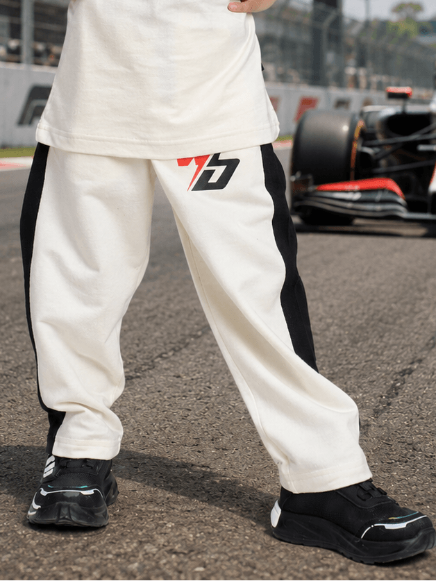 SPEED SURGE JOGGER FOR BOYS AND GIRLS WHITE BLACK, featuring a sporty design in white and black.