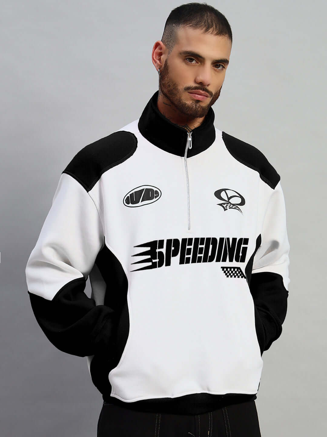 Men's black and white SPEEDING colorblock jacket by DUDS, customizable fit available, featuring bold lettering and zipper closure.