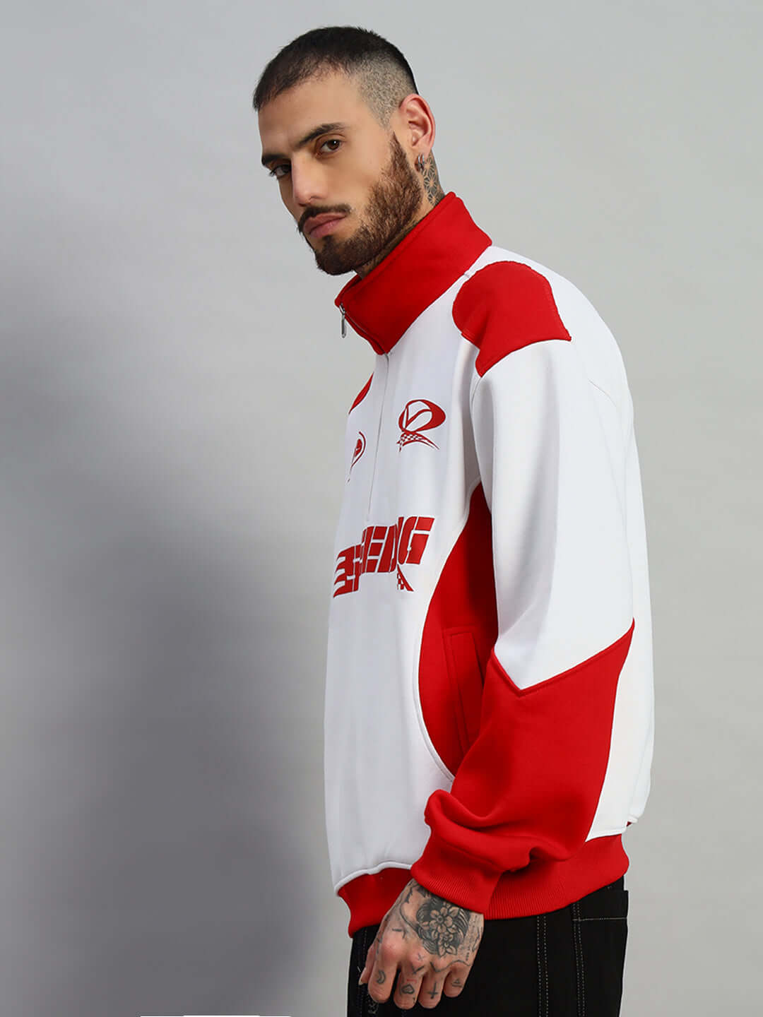 Man wearing a red and white SPEEDING Colorblock Jacket, side view. Tailored by DUDS, customizable fit available.