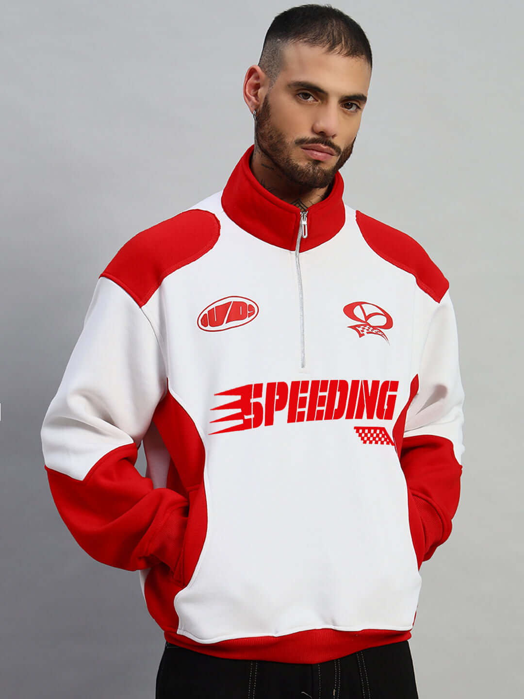 Man wearing a red and white Speeding Colorblock Jacket by DUDS