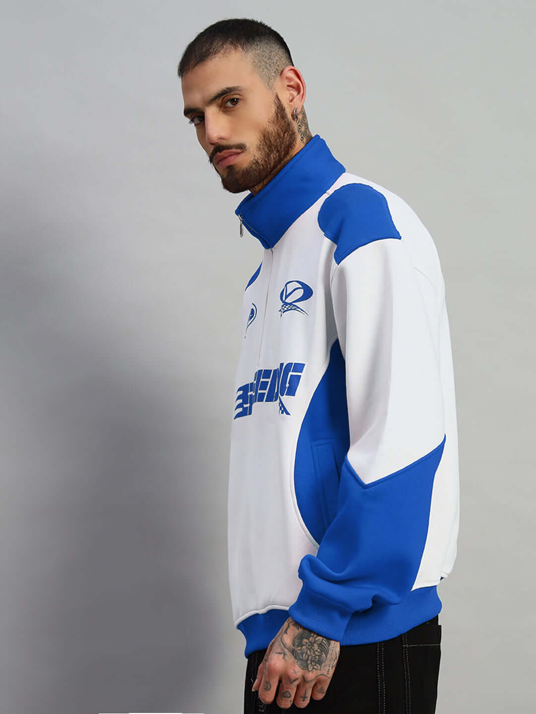 Alt Tag: Model wearing royal blue and white Speeding Colorblock Jacket, made to order by DUDS, featuring customizable fit options.