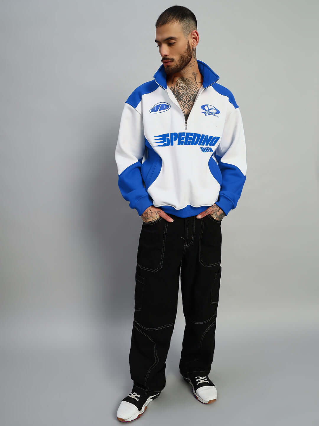 Model wearing SPEEDING Colorblock Jacket in royal blue and white, showcasing casual fashion by DUDS. Made-to-order garment.