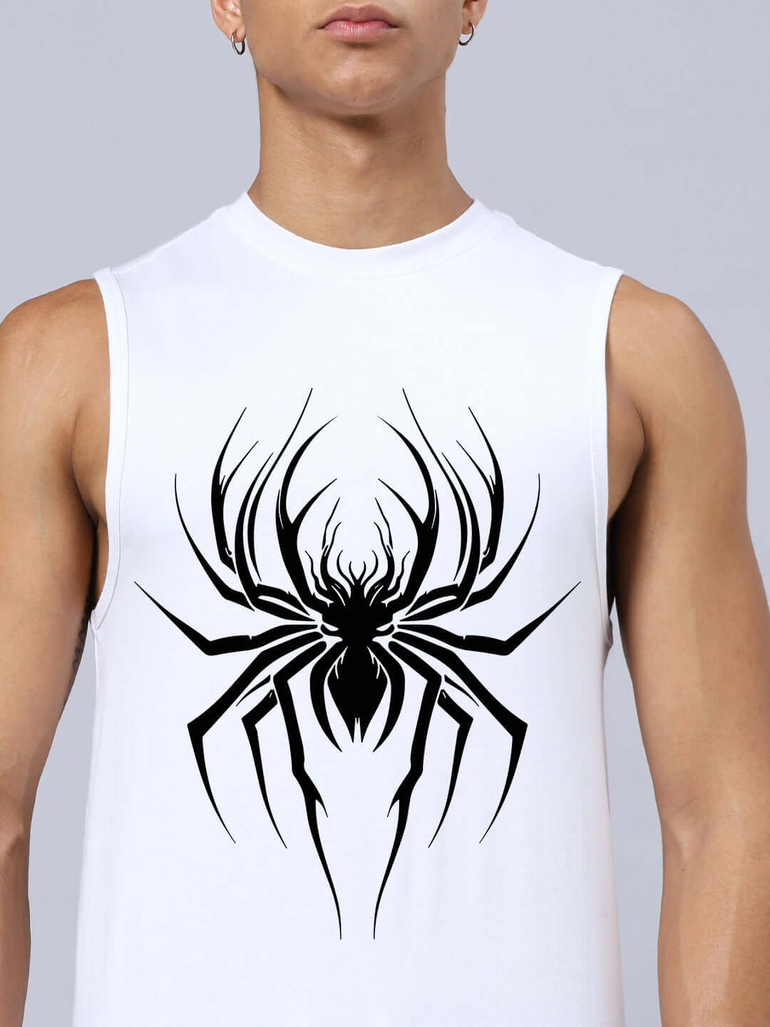 Man wearing SPIDER PRINTED GYM RELAXED FIT CO-ORD SET WHITE-BLACK with bold spider graphic on the chest.