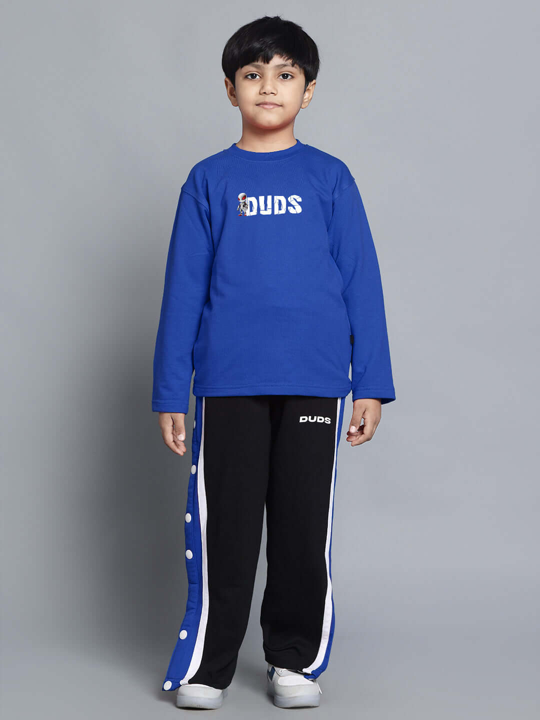 Boy wearing SPIDERROBO COTTON CO-ORD FOR BOYS AND GIRLS BLUE BLACK, featuring blue top and black pants with white accents.