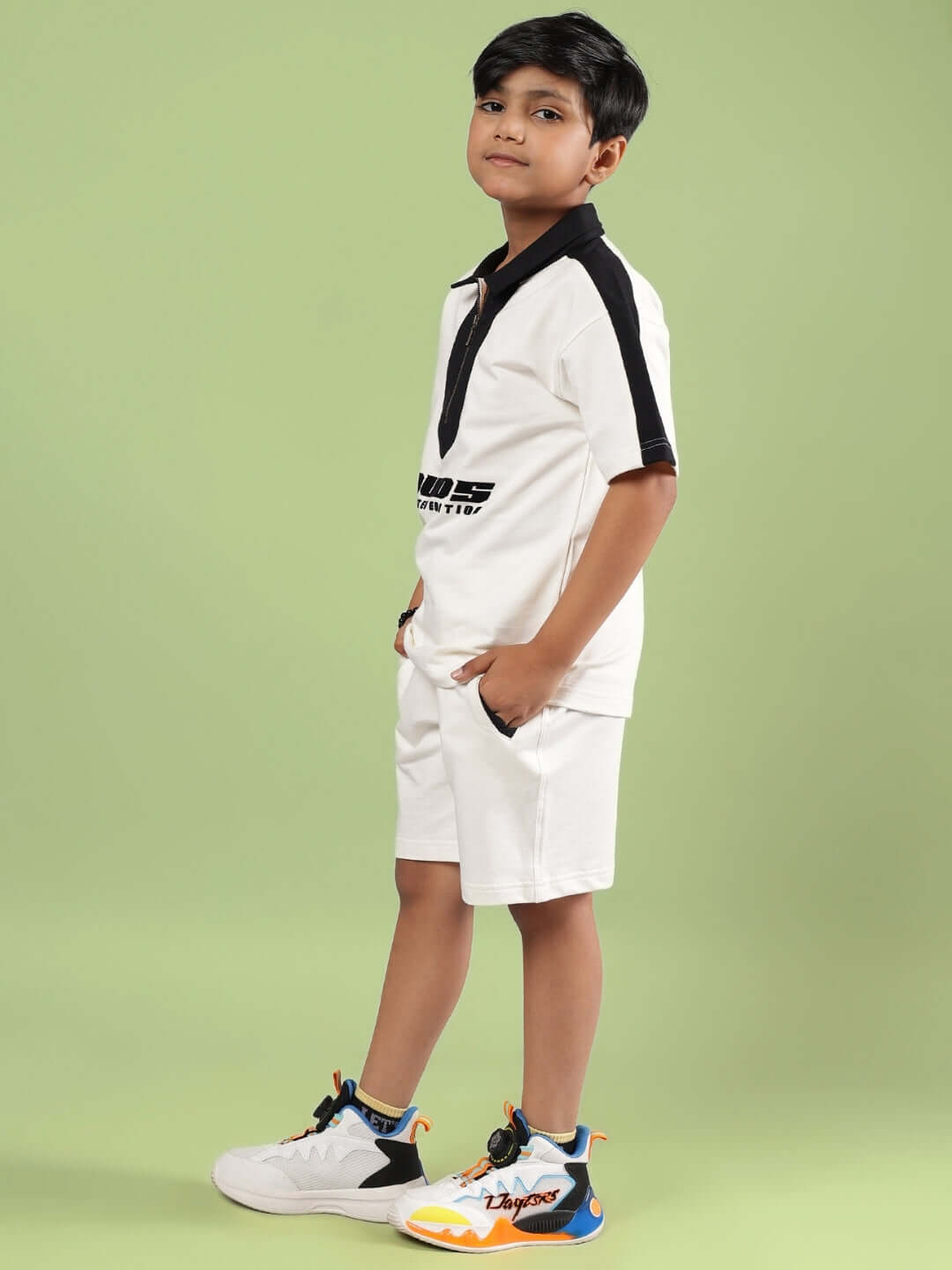 Boy wearing SPLINTER SUMMER CO-ORD FOR BOYS & GIRLS OFF WHITE, showcasing matching top and shorts set in a trendy and comfortable style.