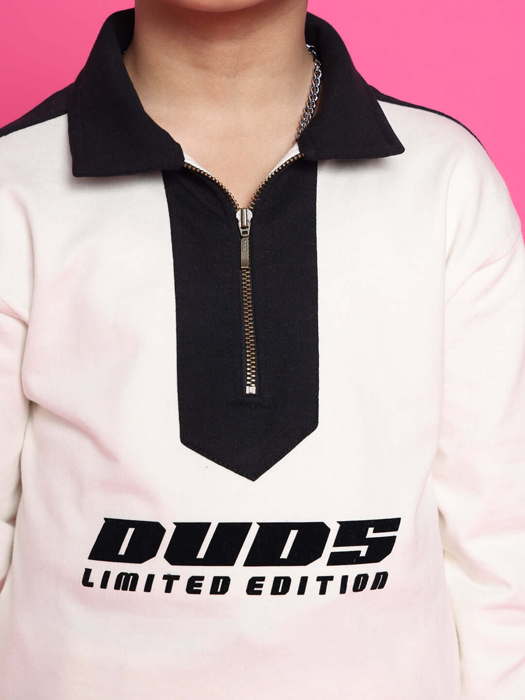 Child wearing SPLINTER OVERSIZED CO-ORD SET FOR BOYS GIRLS OFF WHITE BLACK with zip detail.